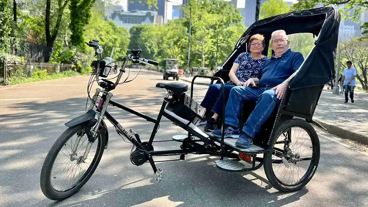 Corporate Group 1 Corporate pedicab tour NYC group riding through Central Park for team building